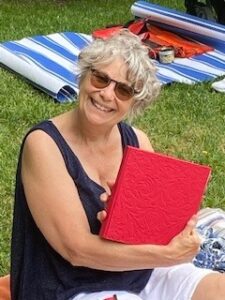 Jan holding her photo album